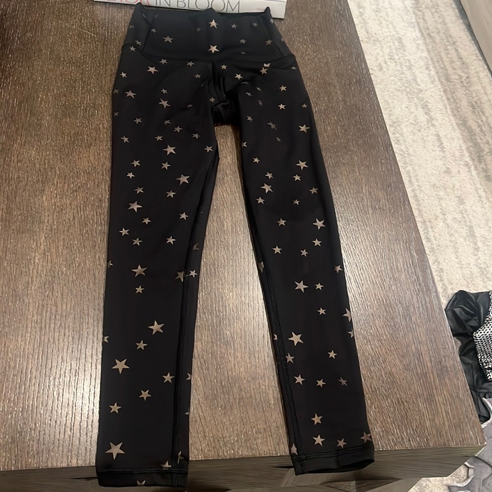 Chrldr black with gold star girls leggings size Xs.